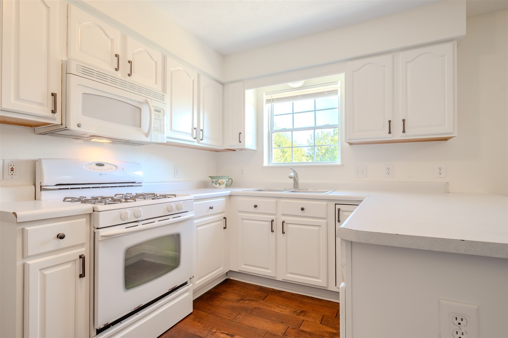 4397 North 3200 East Road Arrowsmith, IL 61722 - Photo 10 of 33 a kitchen with cabinets appliances a sink and a window