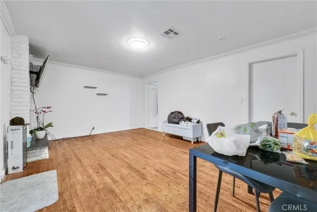 a kitchen with stainless steel appliances a sink a stove and a refrigerator