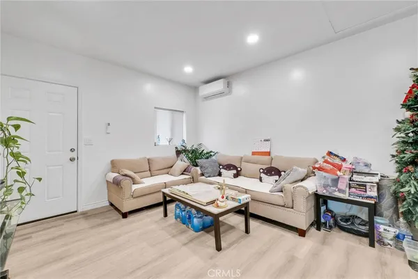 a living room with furniture and a table