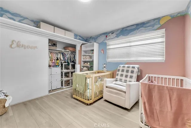 a living room with furniture and two window