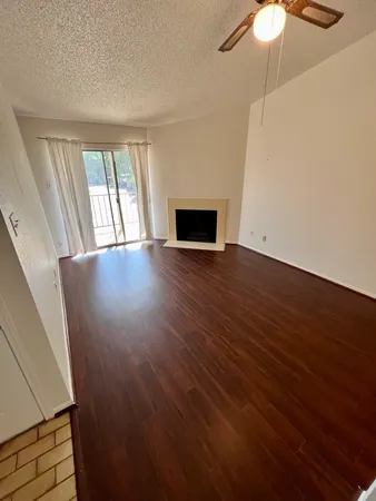 a view of a kitchen with wooden floor
