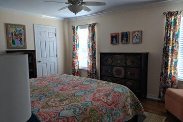 40 Inlet Drive Miramar Beach, FL 32550 - Photo 14 of 31 a bedroom with a bed and a chandelier