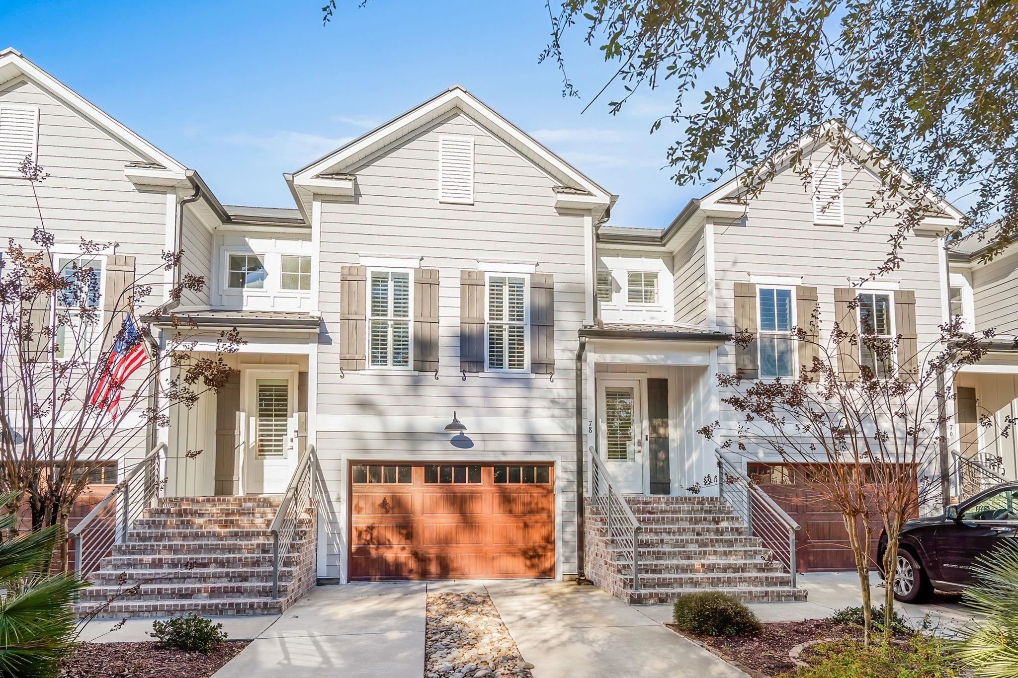 Raised ranch with a garage and concrete driveway