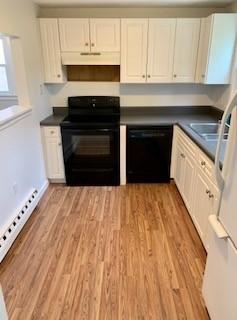 1431 Iyannough Road, Unit 7U Centerville, MA 02632 - Photo 3 of 11 a kitchen with granite countertop a stove and a sink