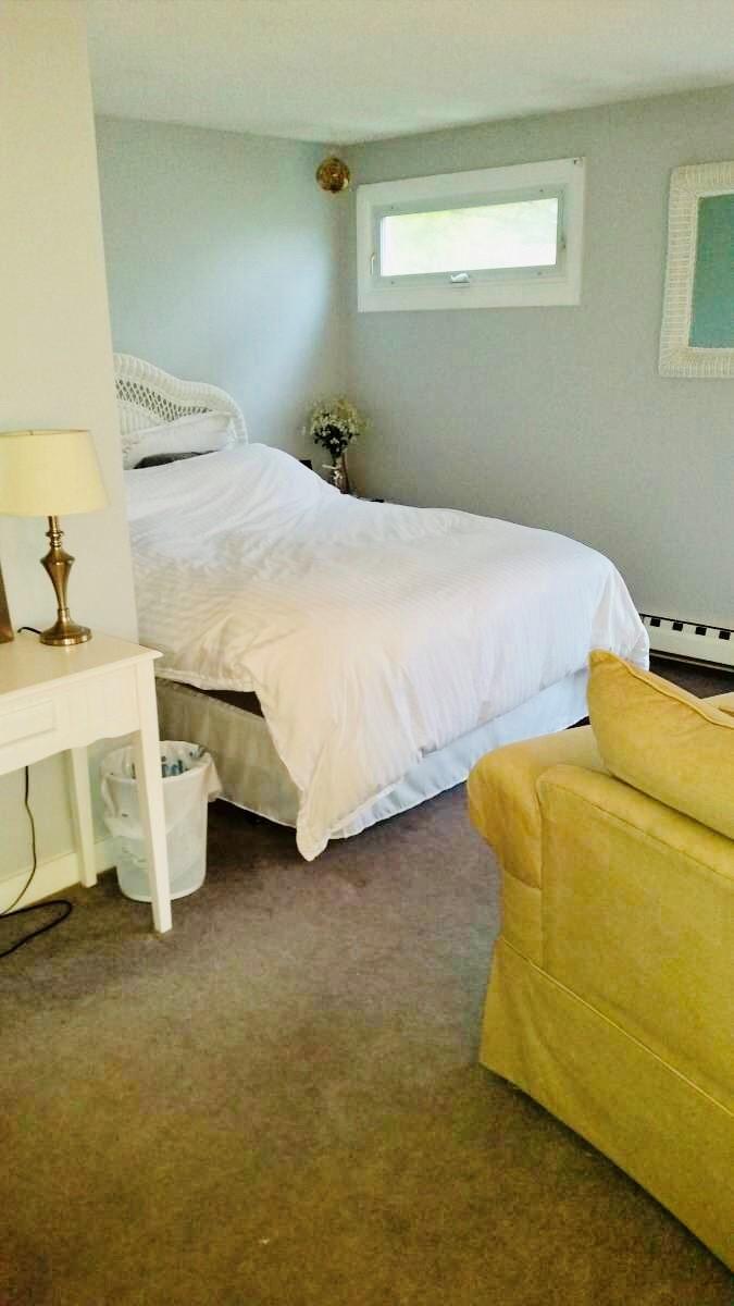 1431 Iyannough Road, Unit 7U Centerville, MA 02632 - Photo 6 of 11 a bedroom with a bed and a table