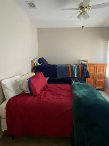 a bedroom with a bed and a fireplace