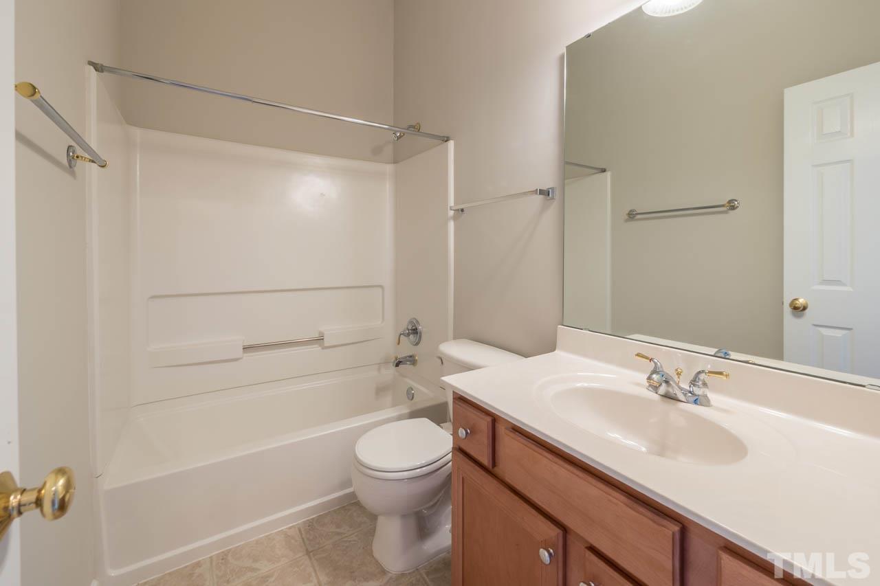 6949 Middleboro Drive Raleigh, NC 27612 - Photo 27 of 35 a bathroom with a sink a toilet and shower