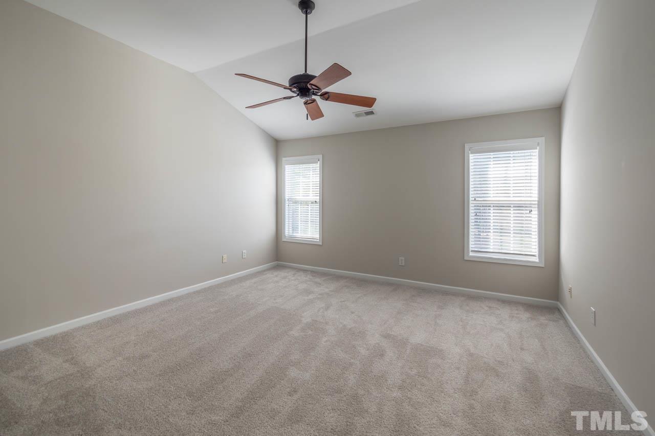 6949 Middleboro Drive Raleigh, NC 27612 - Photo 29 of 35 a view of an empty room with a window