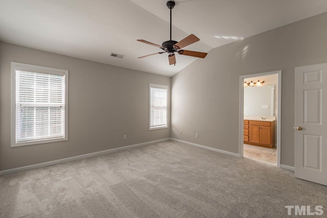 6949 Middleboro Drive Raleigh, NC 27612 - Photo 30 of 35 a view of an empty room with a window