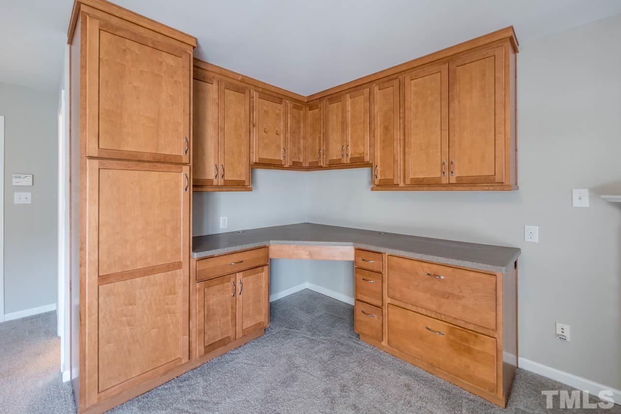 6949 Middleboro Drive Raleigh, NC 27612 - Photo 8 of 35 a kitchen with stainless steel appliances granite countertop a refrigerator and a sink