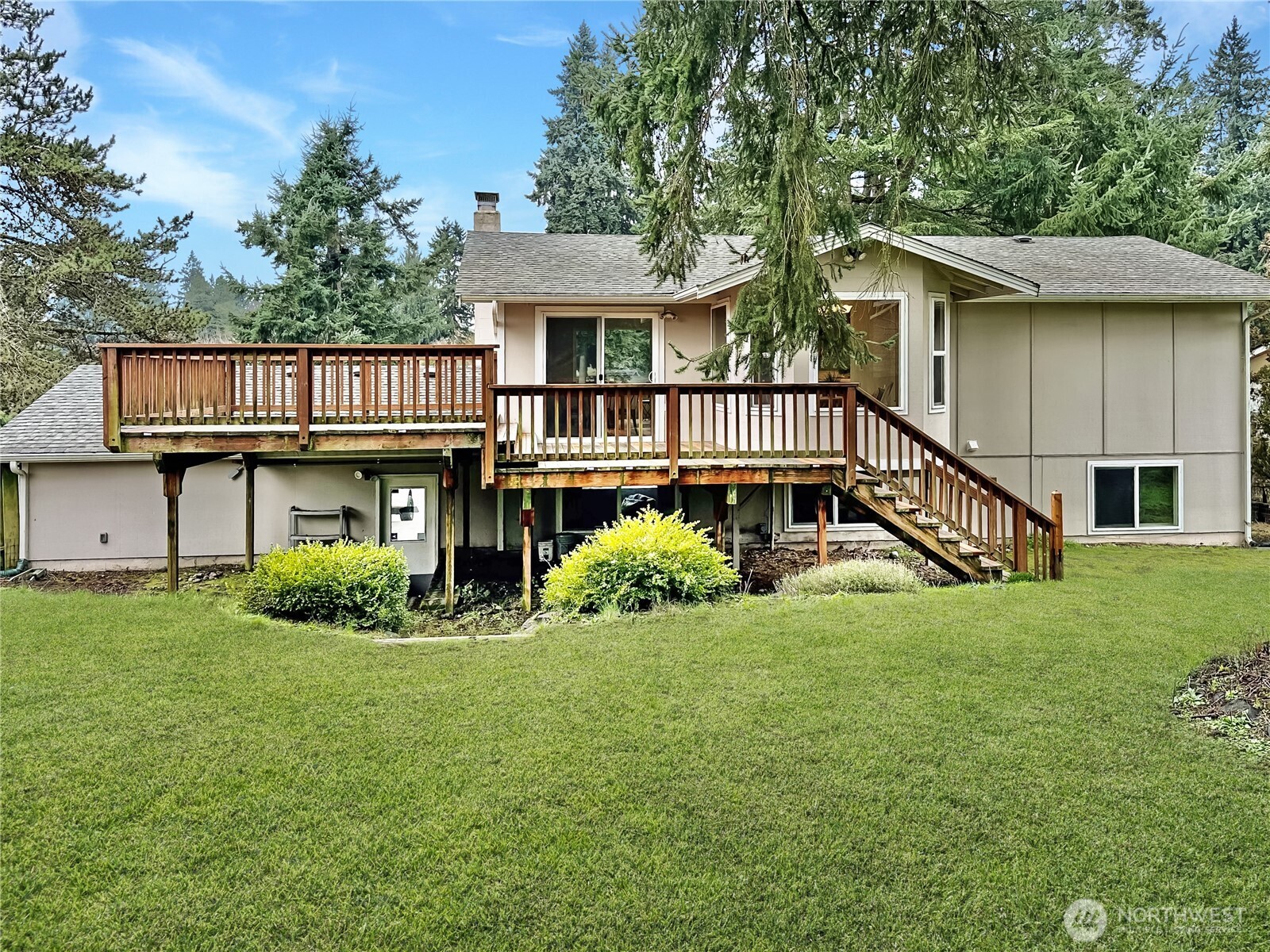7910 Husky Way Southeast Lacey, WA 98503 - Photo 2 of 36 a view of a house with a yard and deck