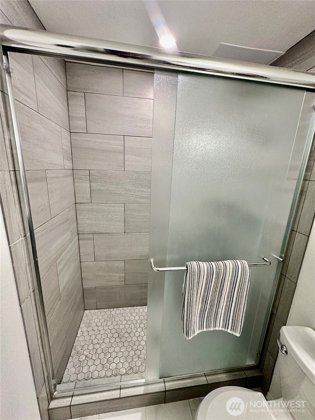 7910 Husky Way Southeast Lacey, WA 98503 - Photo 24 of 36 a bathroom with a bathtub and shower