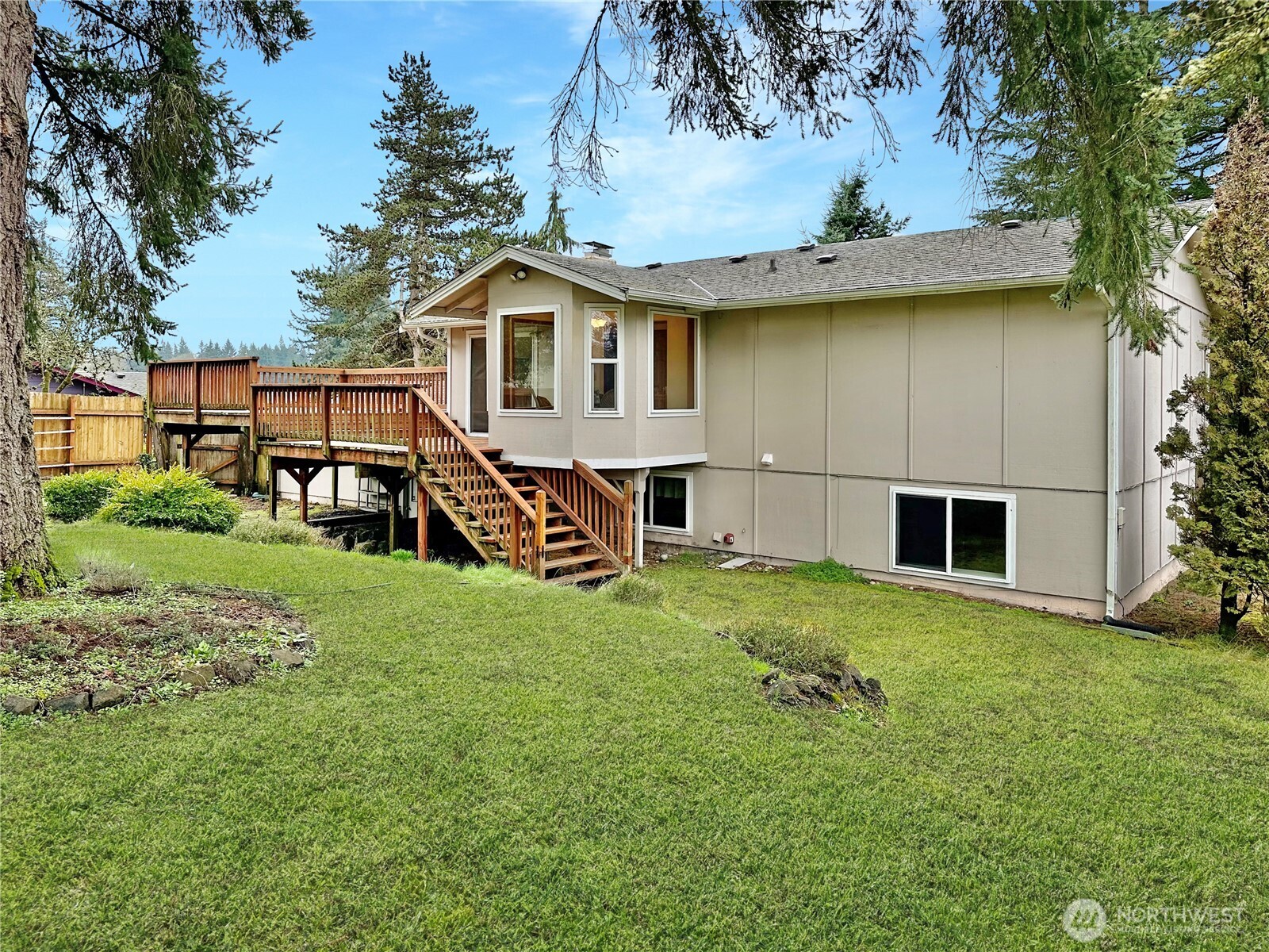 7910 Husky Way Southeast Lacey, WA 98503 - Photo 33 of 36 a view of a backyard with a garden and plants