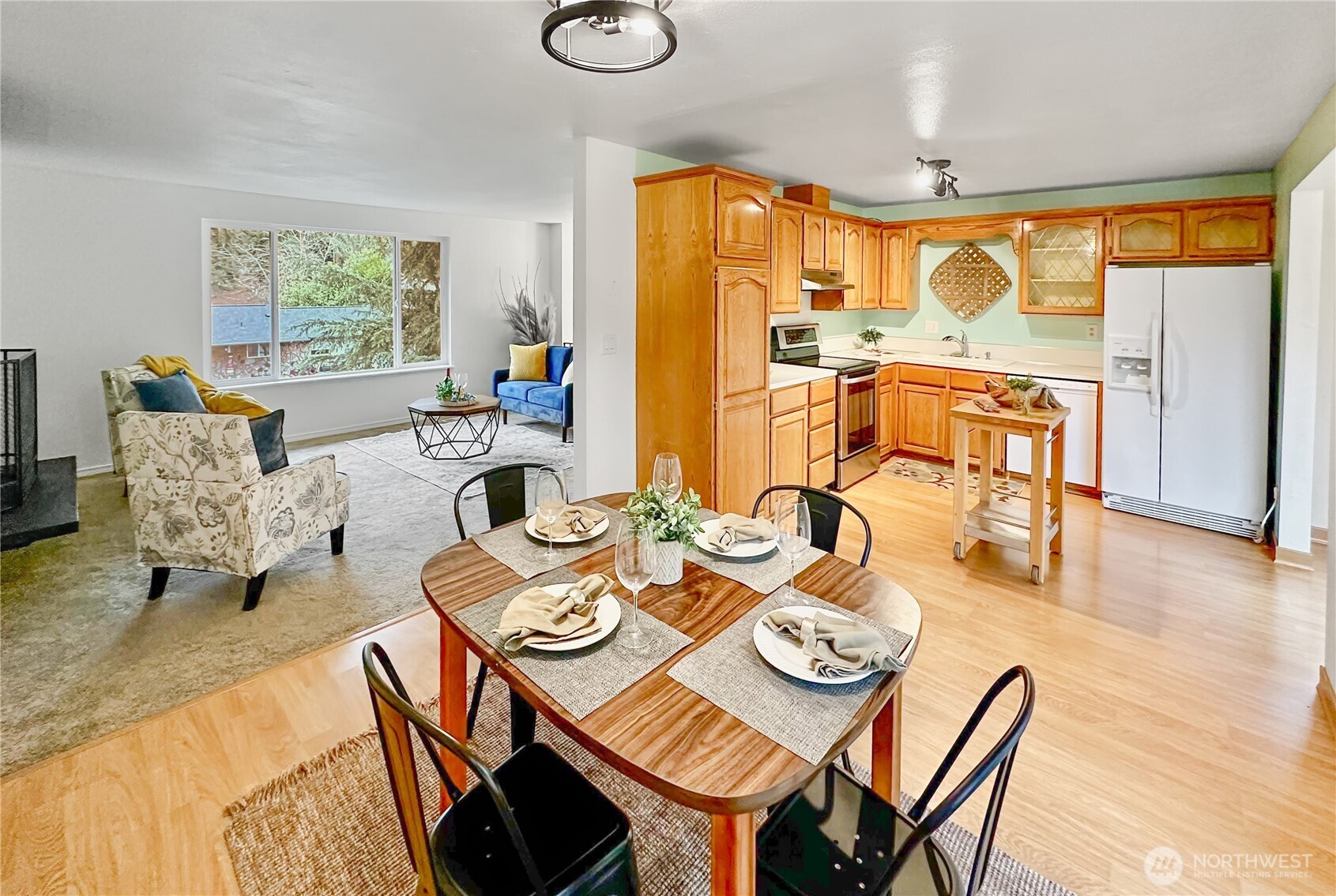 7910 Husky Way Southeast Lacey, WA 98503 - Photo 5 of 36 a view of a dining room with furniture window and wooden floor