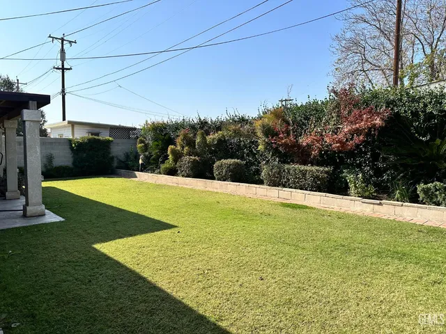 a view of a swimming pool with a yard