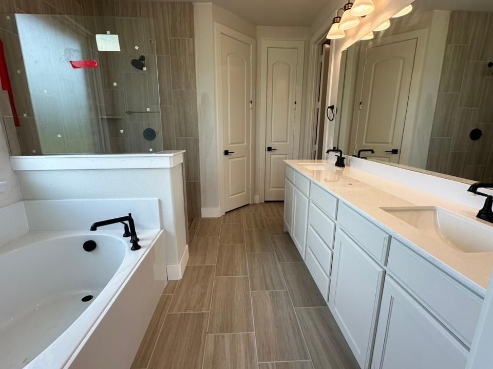 605 Brown Road Leonard, TX 75452 - Photo 13 of 25 Bathroom featuring a dual vanity with white cabinetry, integrated sinks, and black fixtures
