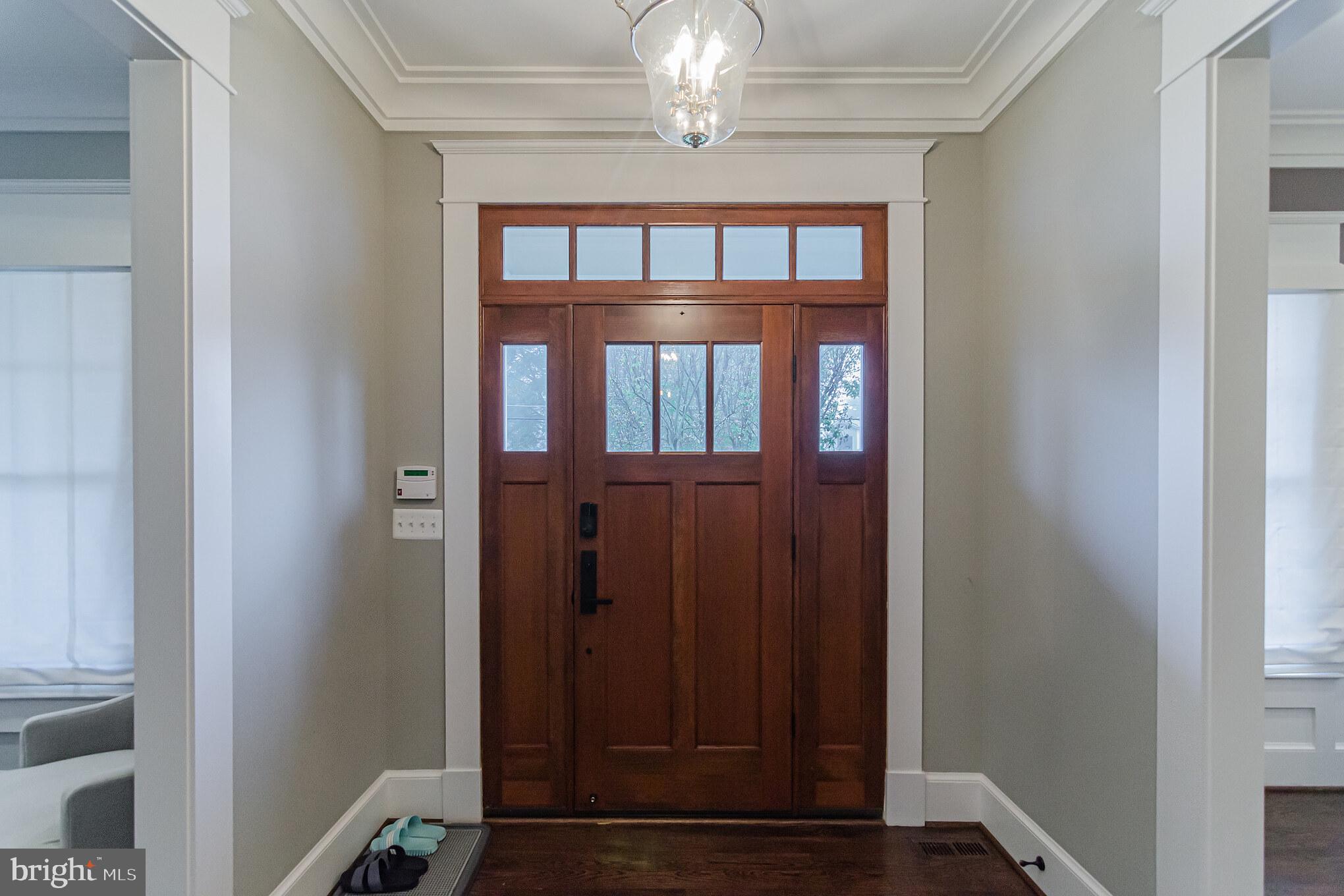 6801 Danforth Street McLean, VA 22101 - Photo 4 of 29 a view of a hallway with wooden floor and staircase