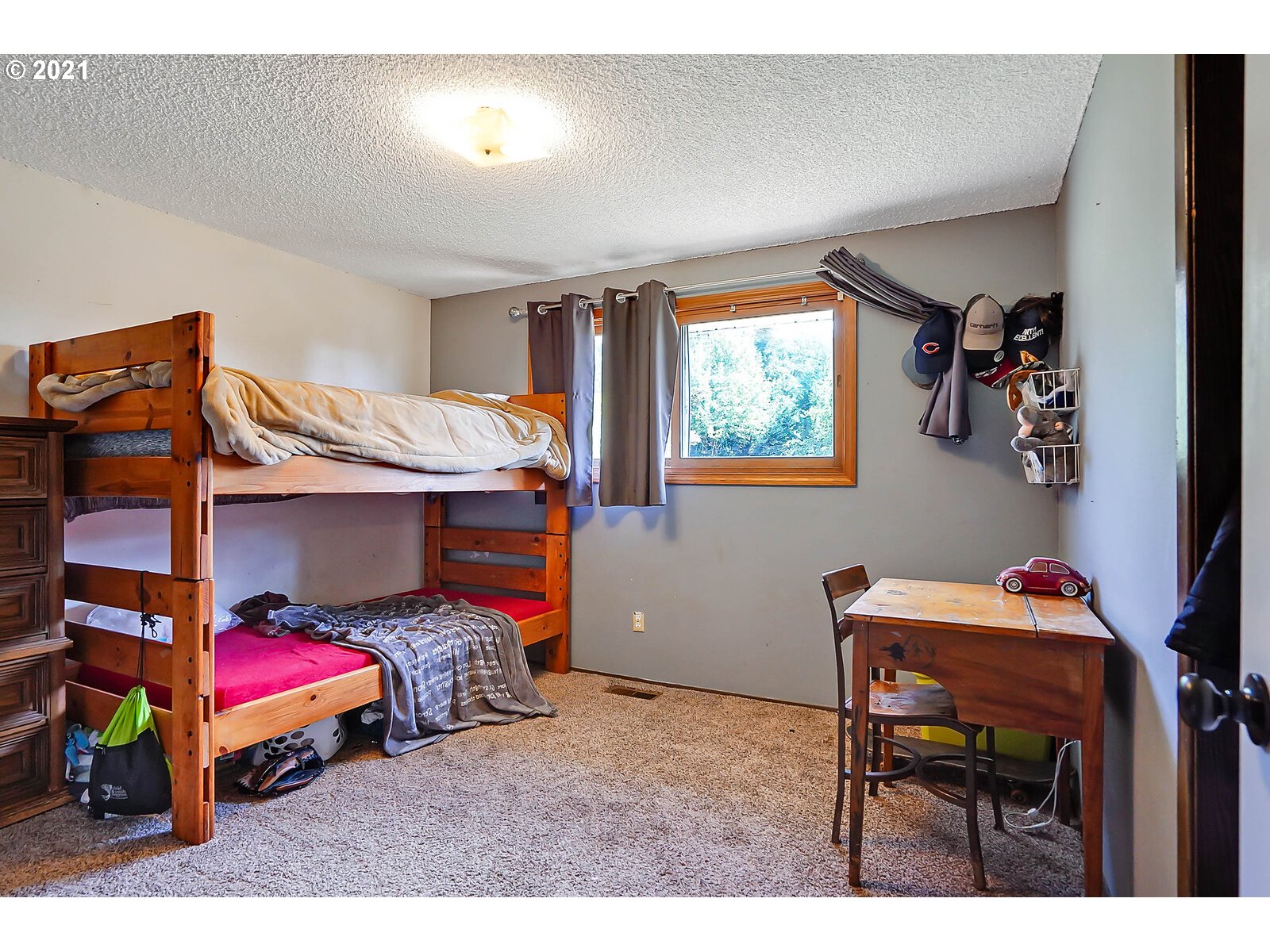 15145 Guthrie Road Dallas, OR 97338 - Photo 16 of 32 a bedroom with furniture and a chair