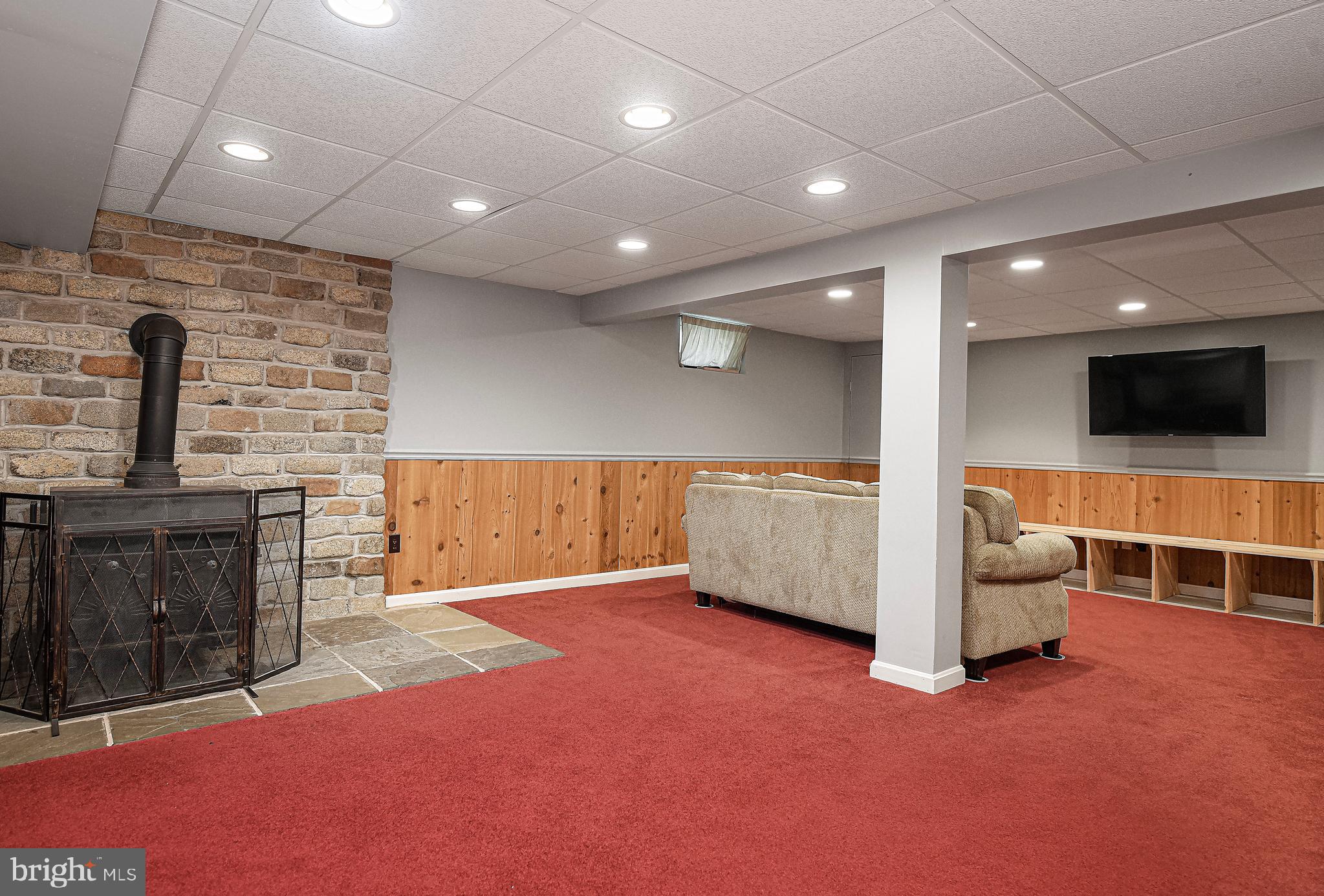 426 Gilmor Road Joppa, MD 21085 - Photo 23 of 42 Finished LL offers wood stove w/ stone hearth