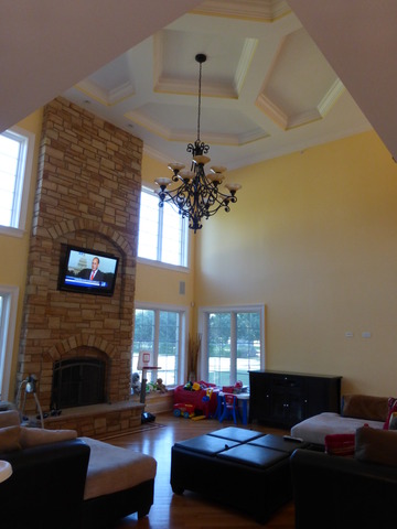 311 North Westgate Road Mount Prospect, IL 60056 - Photo 4 of 18 a living room with furniture a fireplace and a chandelier