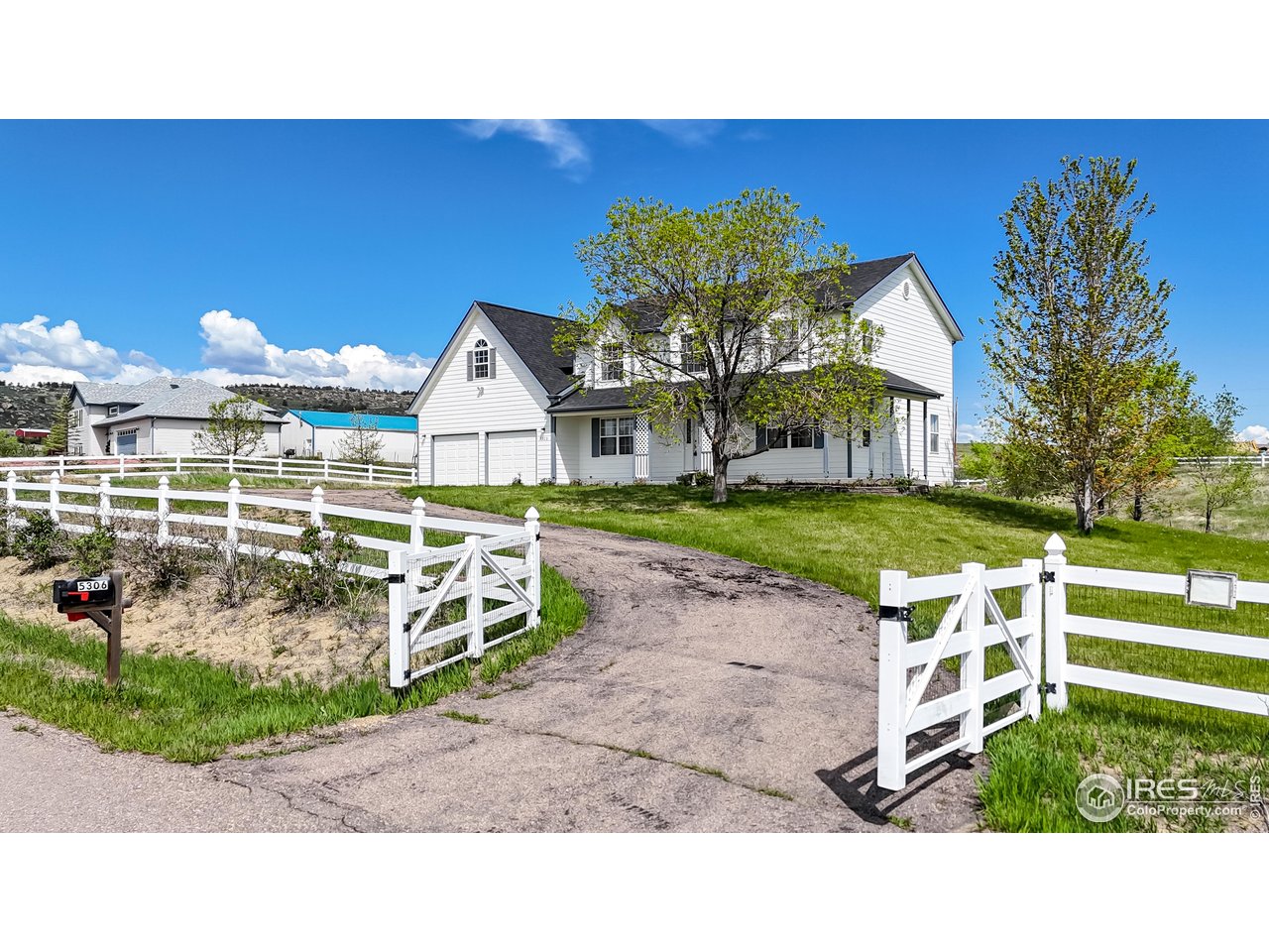 5306 Foothills Drive Berthoud, CO 80513 - Photo 2 of 40 a view of a house with backyard porch and sitting area