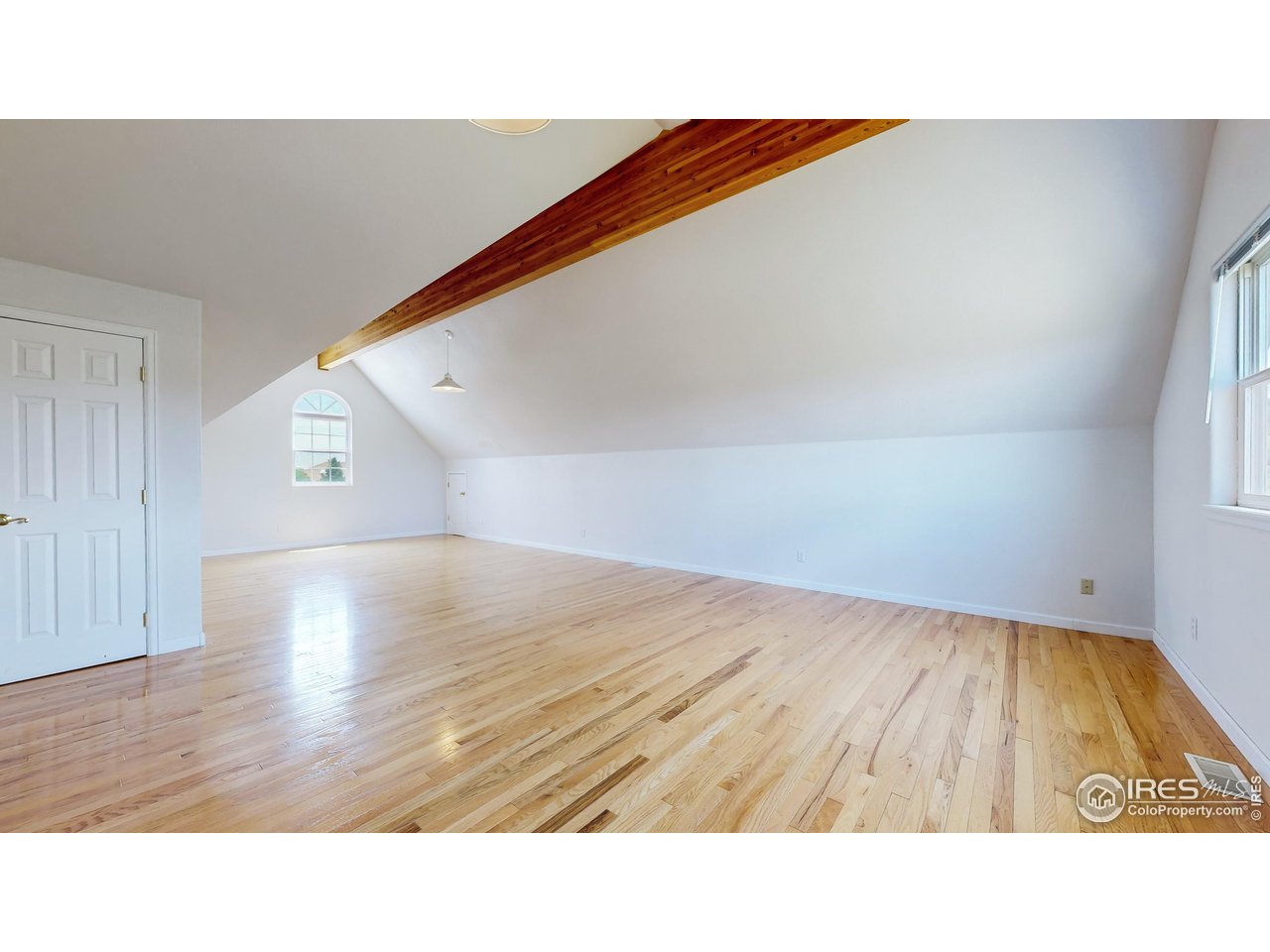 5306 Foothills Drive Berthoud, CO 80513 - Photo 23 of 40 a picture of an empty room and wooden floor