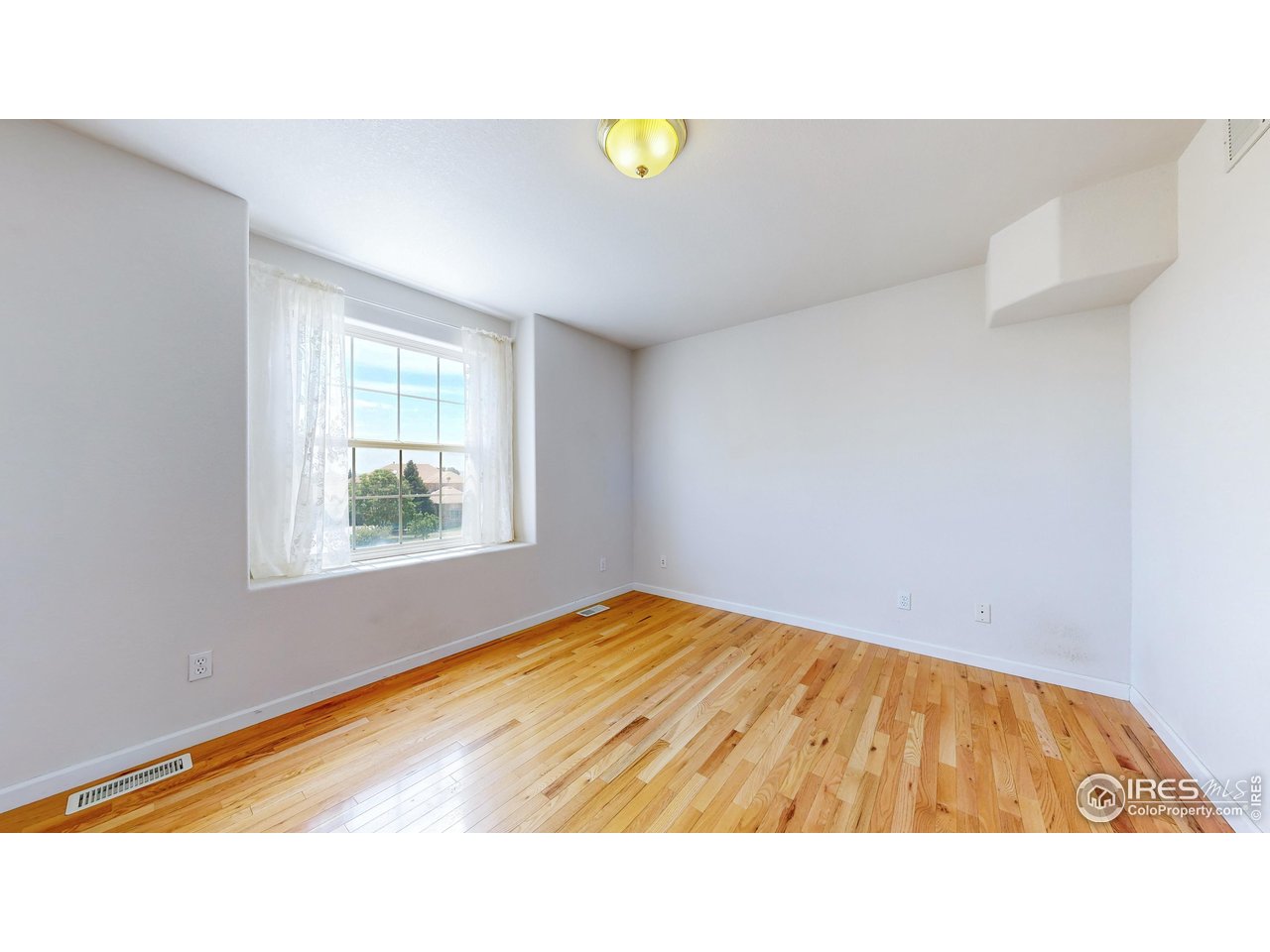 5306 Foothills Drive Berthoud, CO 80513 - Photo 26 of 40 a view of an empty room and window