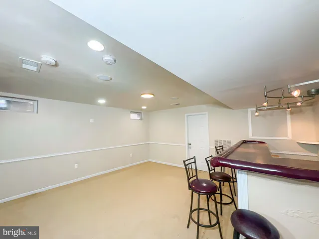 a room with gym equipment and windows