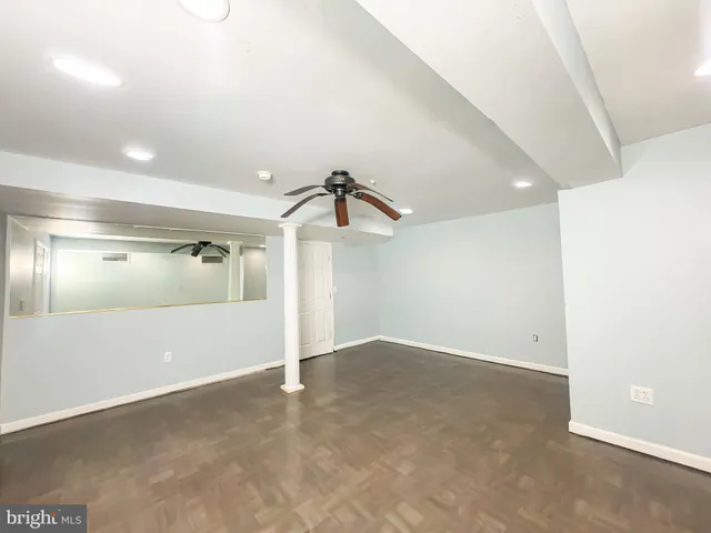 an empty room with windows and entrance