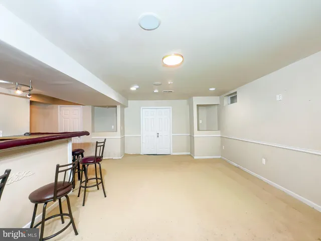 a view of a livingroom with furniture and a window