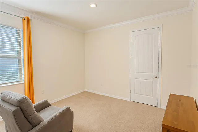 a living room with a couch and a window