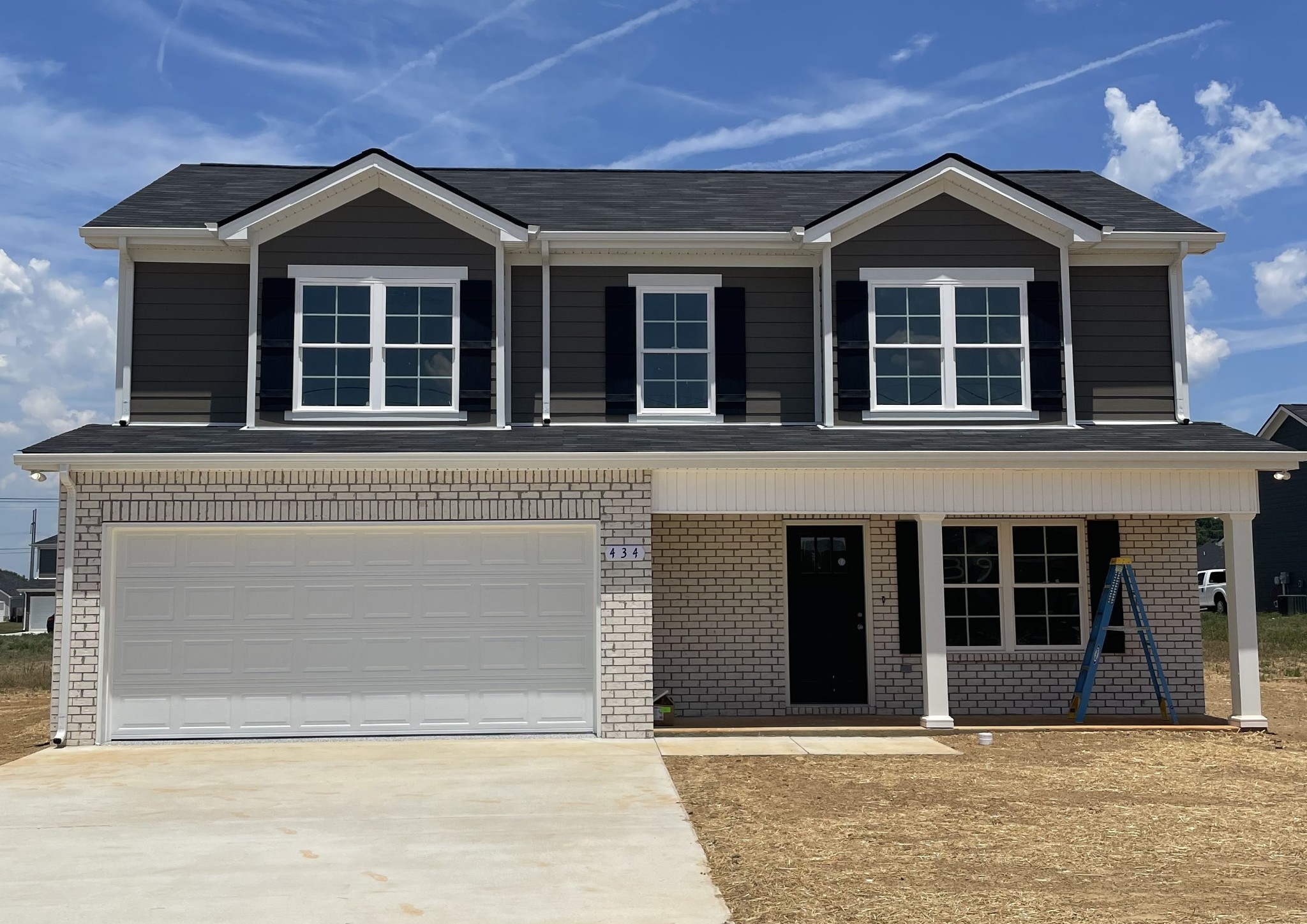 434 Mimosa Drive Decherd, TN 37324 - Photo 1 of 6 a front view of a house with a yard