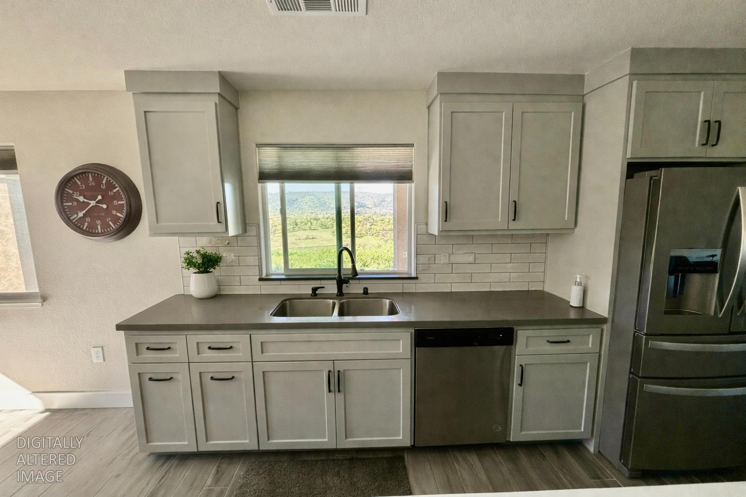 2481 Quail Hill Road Copperopolis, CA 95228 - Photo 14 of 23 a kitchen with stainless steel appliances granite countertop a sink stove and refrigerator