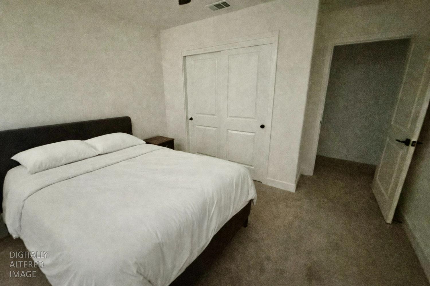 2481 Quail Hill Road Copperopolis, CA 95228 - Photo 16 of 23 a large bed sitting in a bedroom next to a window