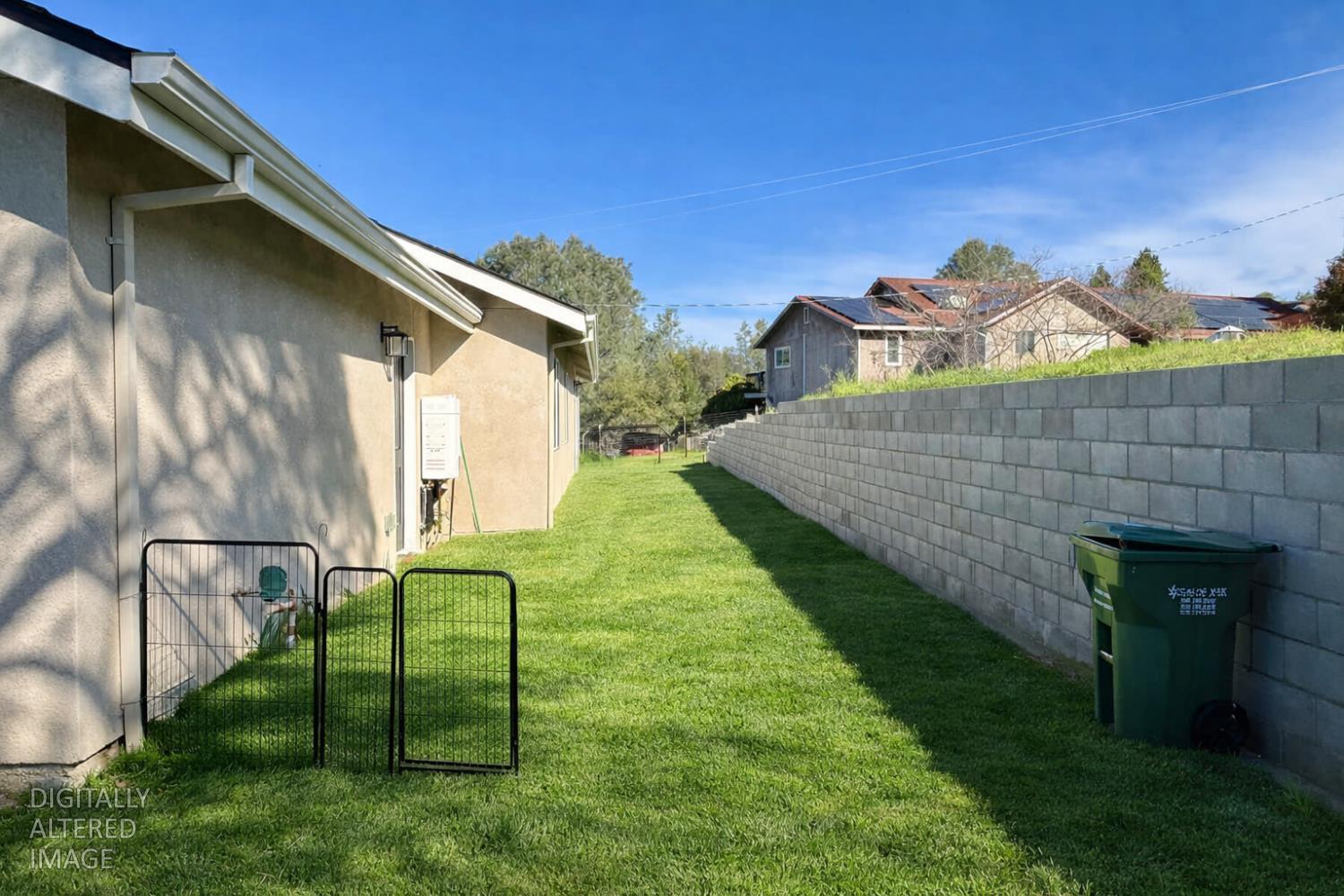 2481 Quail Hill Road Copperopolis, CA 95228 - Photo 21 of 23 a backyard of a house with table and chairs