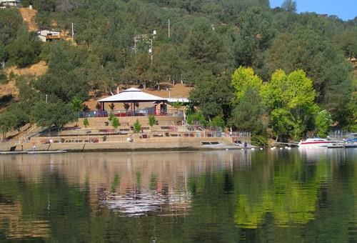 2481 Quail Hill Road Copperopolis, CA 95228 - Photo 23 of 23 a view of a lake with a house swimming pool and outdoor space