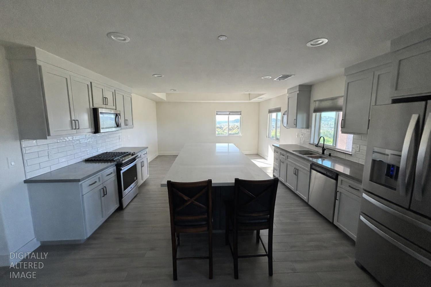 2481 Quail Hill Road Copperopolis, CA 95228 - Photo 5 of 23 a large kitchen with a table and chairs