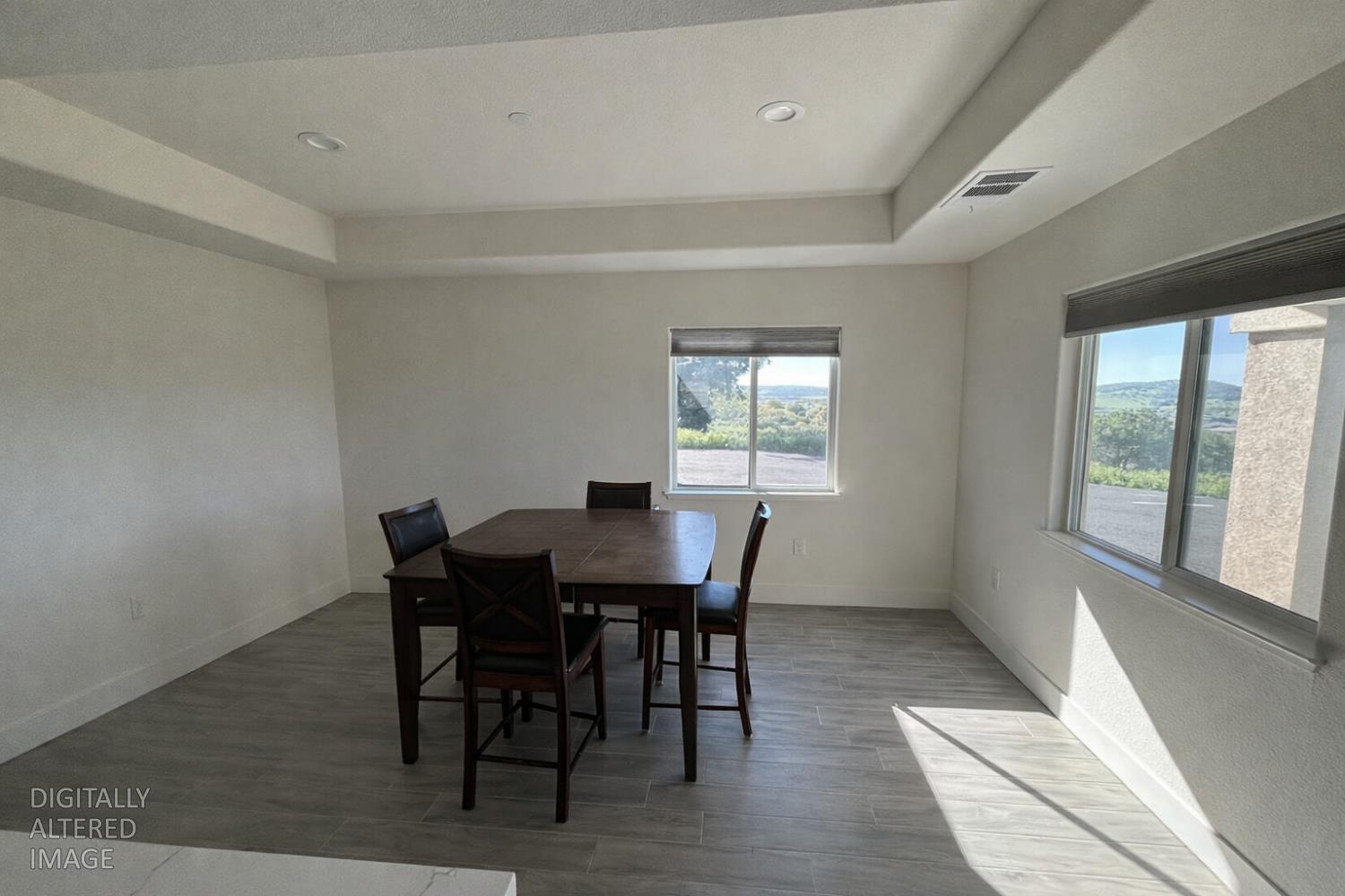 2481 Quail Hill Road Copperopolis, CA 95228 - Photo 6 of 23 a view of a dining room with furniture and wooden floor