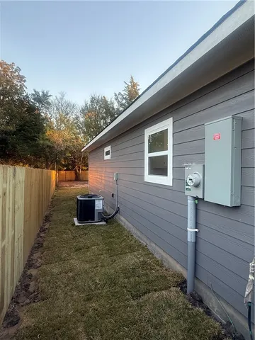 a backyard of a house with table and chairs