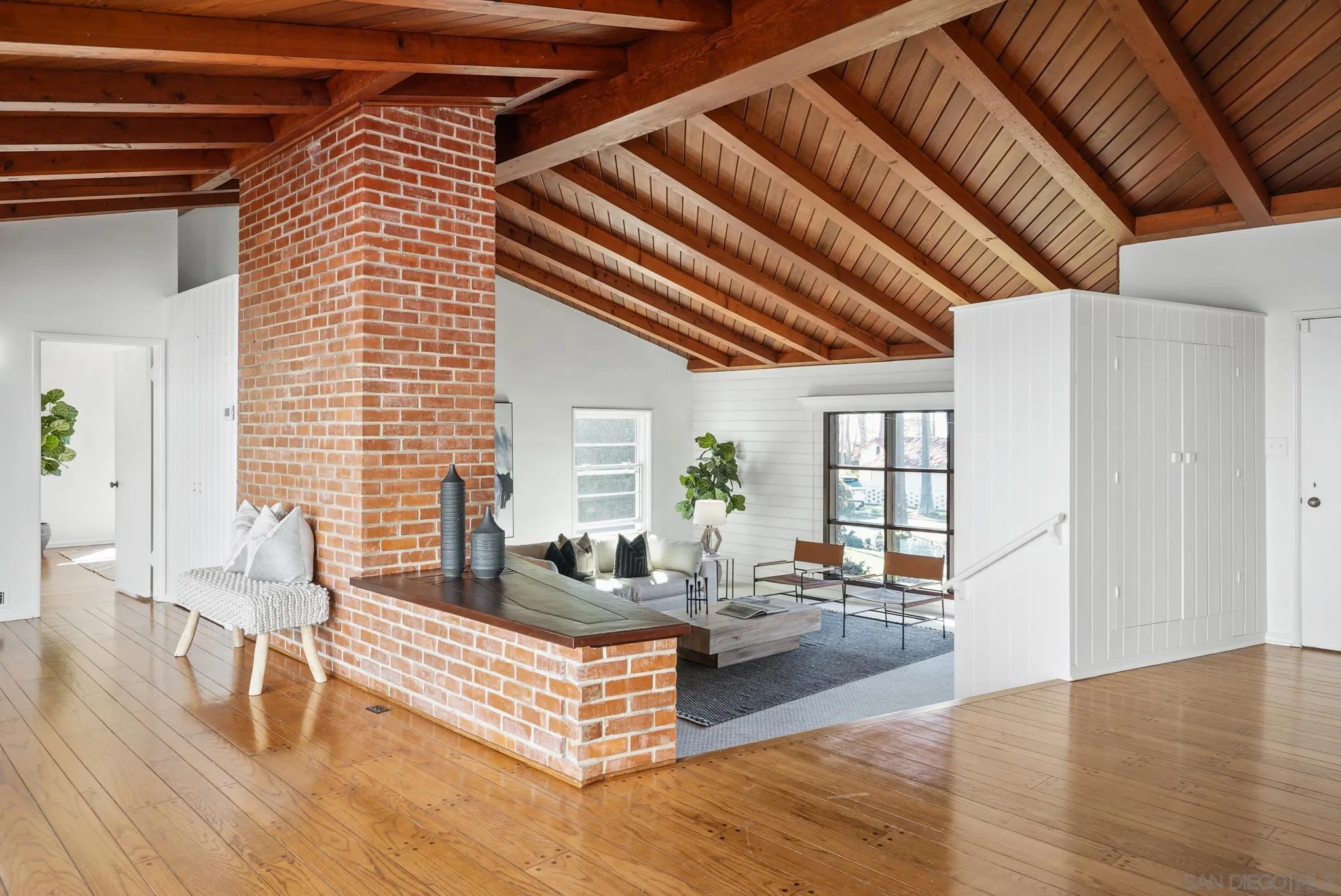 6423 Avenida Cresta La Jolla, CA 92037 - Photo 11 of 33 a living room with furniture and a wooden floor