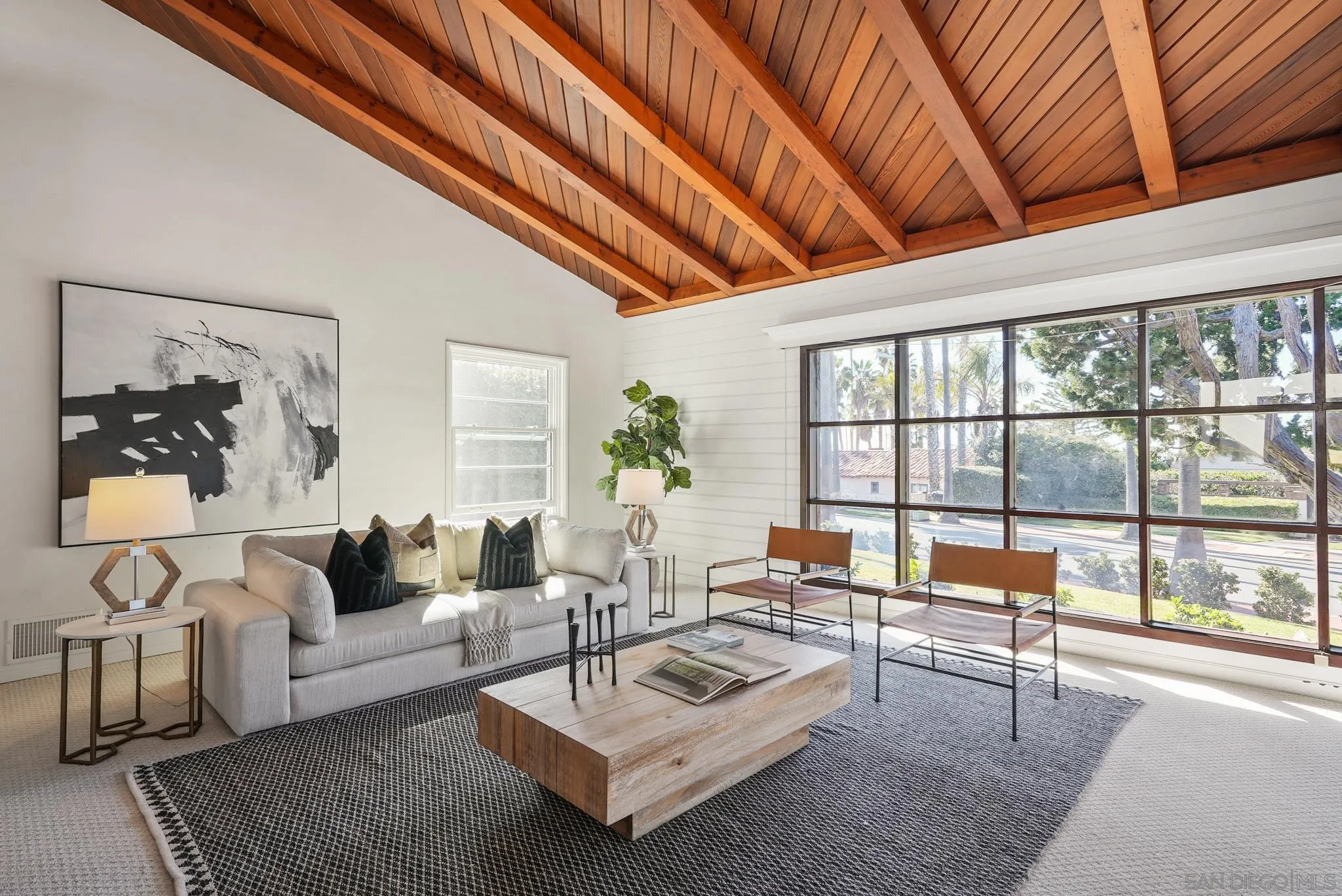 6423 Avenida Cresta La Jolla, CA 92037 - Photo 12 of 33 a living room with furniture and a large window