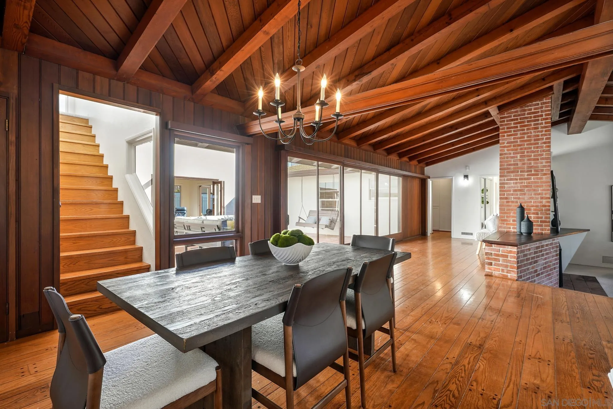 6423 Avenida Cresta La Jolla, CA 92037 - Photo 15 of 33 a dining room with furniture a rug and wooden floor