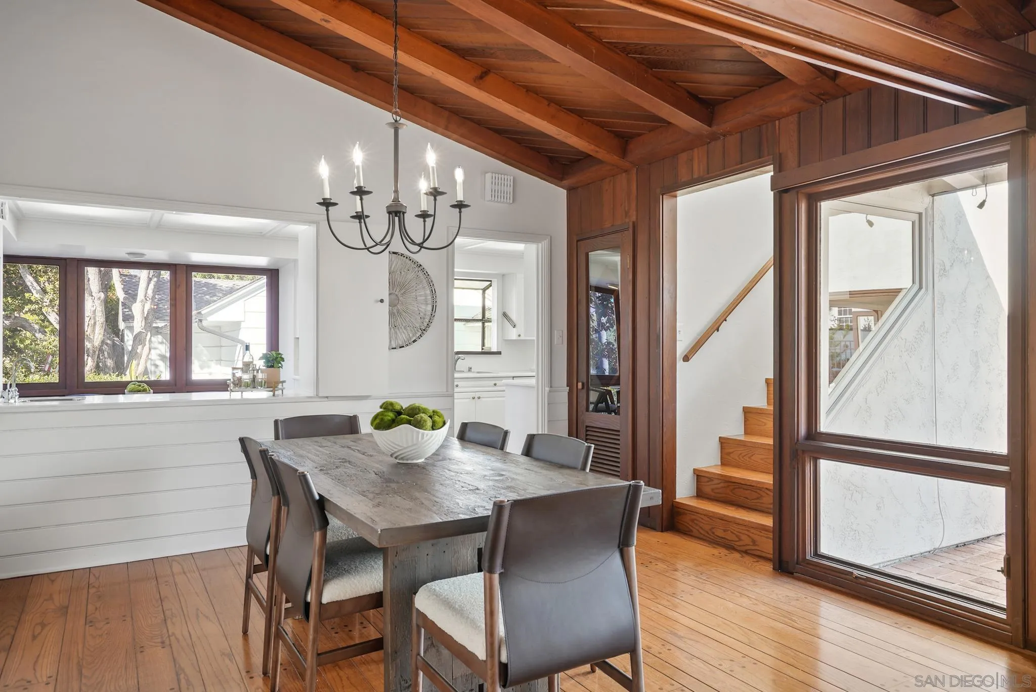 6423 Avenida Cresta La Jolla, CA 92037 - Photo 17 of 33 a view of a dining room with furniture window and wooden floor