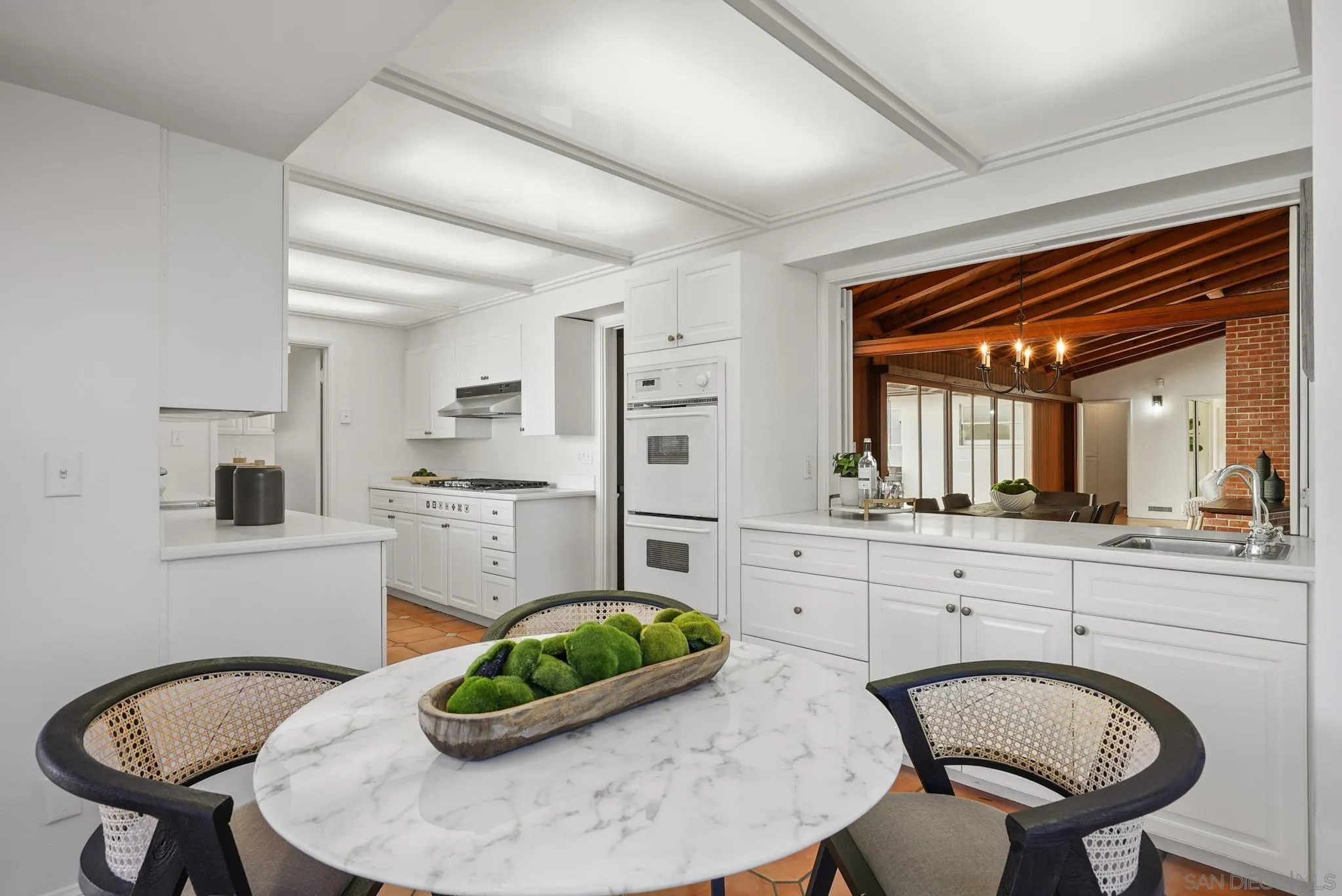 6423 Avenida Cresta La Jolla, CA 92037 - Photo 18 of 33 a kitchen with furniture and a sink