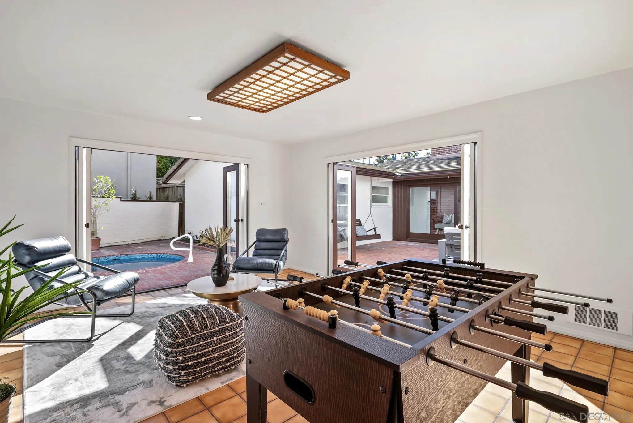 6423 Avenida Cresta La Jolla, CA 92037 - Photo 28 of 33 a living room with furniture and a rug