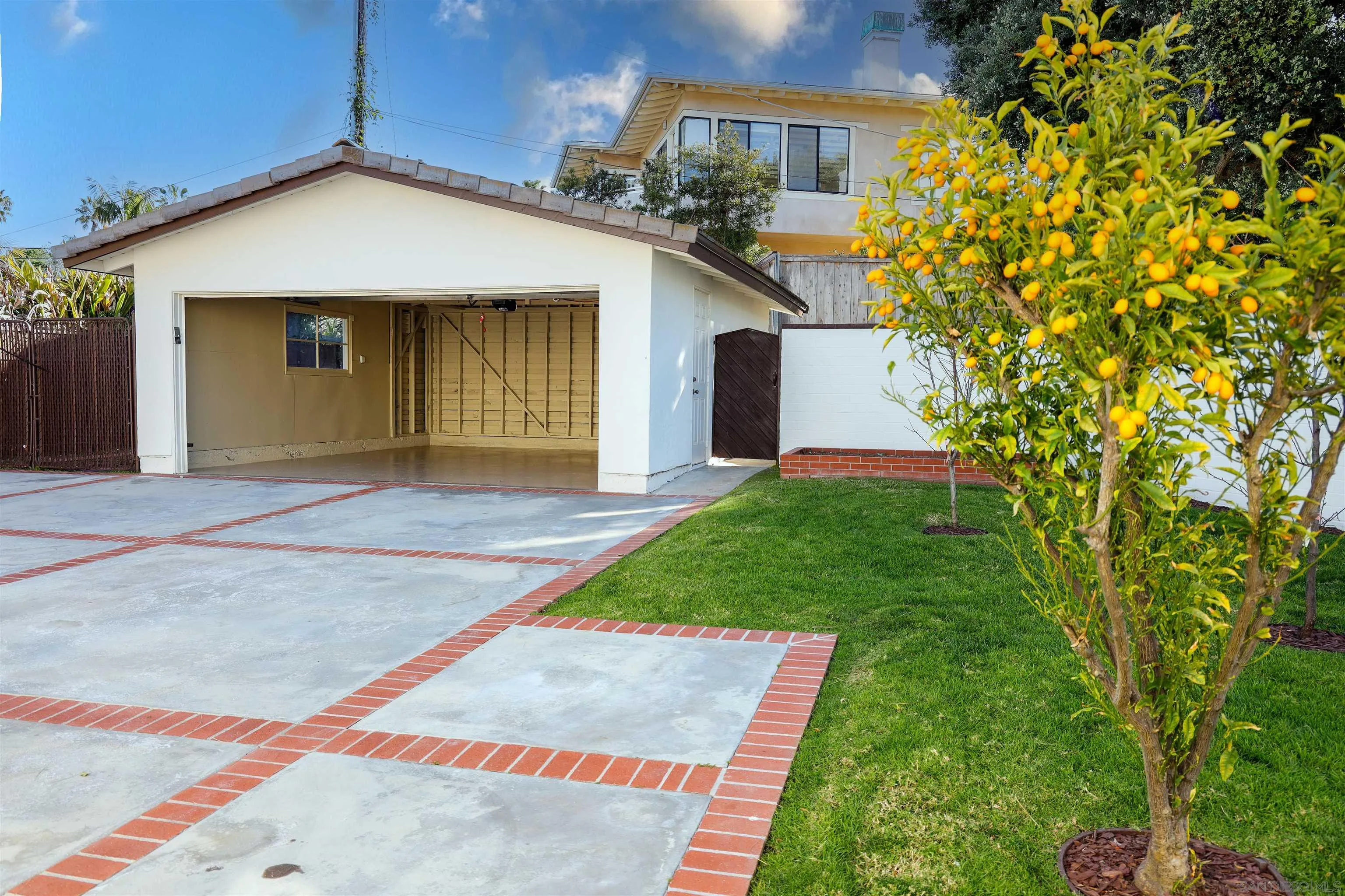 6423 Avenida Cresta La Jolla, CA 92037 - Photo 33 of 33 a front view of a house with a yard and garage