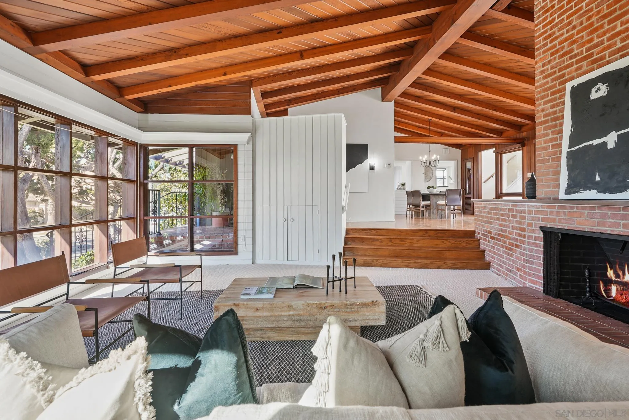 6423 Avenida Cresta La Jolla, CA 92037 - Photo 6 of 33 a living room with furniture and a fireplace