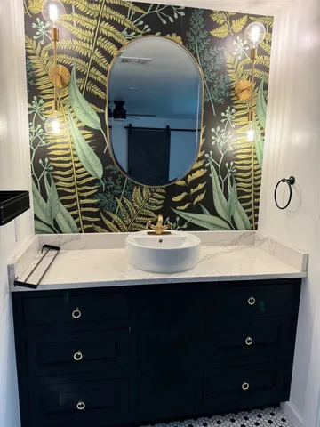 a bathroom with a sink and mirror