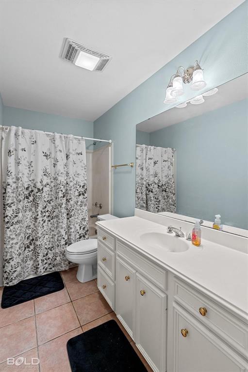 136 Scarborough Road Benton, LA 71006 - Photo 22 of 37 Bathroom featuring a single vanity with an integrated sink, white cabinetry, and gold-tone hardware