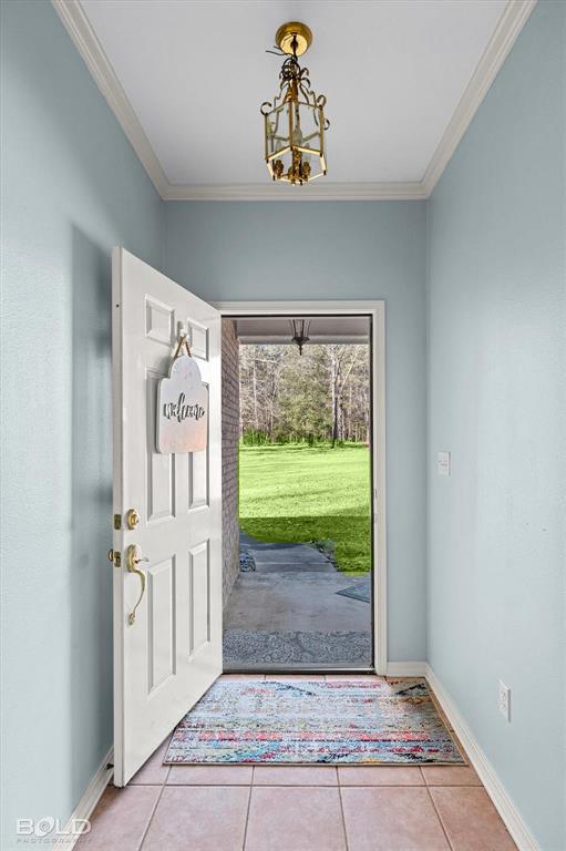 136 Scarborough Road Benton, LA 71006 - Photo 7 of 37 Inviting entryway featuring tile flooring and a decorative brass ceiling fixture